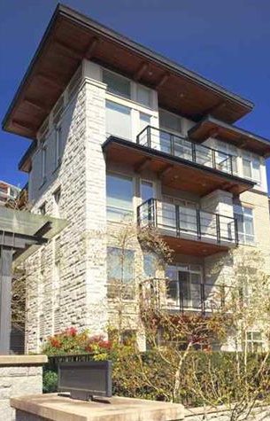 A stone-clad luxury condominium building at UBC