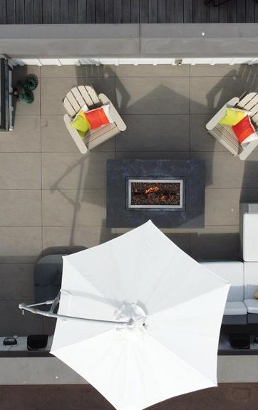 A private townhome roof deck with a fire table in Kits Point, seen from above